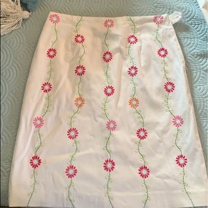 Larkspur, white skirt, size 6. White with floral. Gently owned. Side zip, lined.